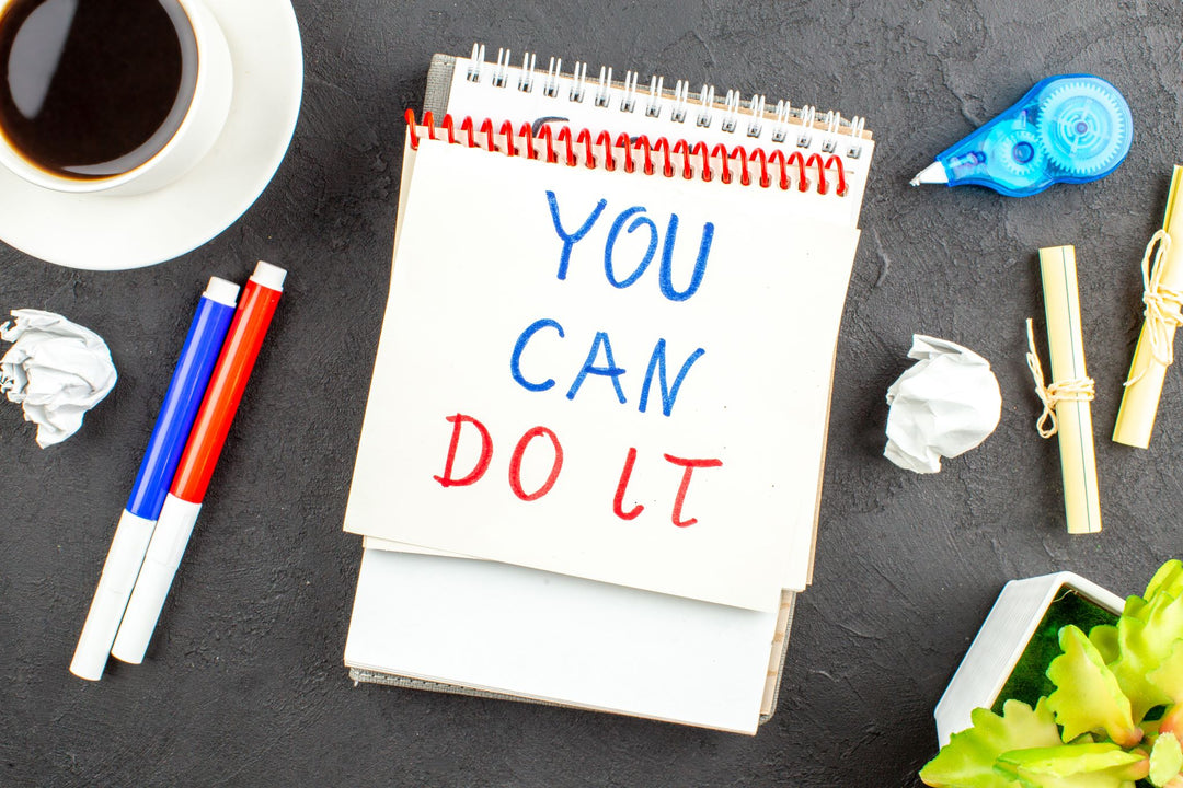 Notepad with "You can do it" written on it.